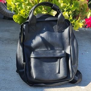 medium sized leather top handle backpack